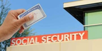 Social Security card in hand in front of the Social Security office, representing cuts in retirement benefits