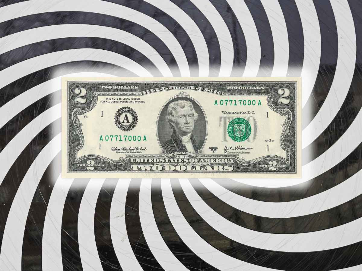 Close-up of a rare $2 bill featuring Thomas Jefferson and green seal, potentially worth thousands to collectors