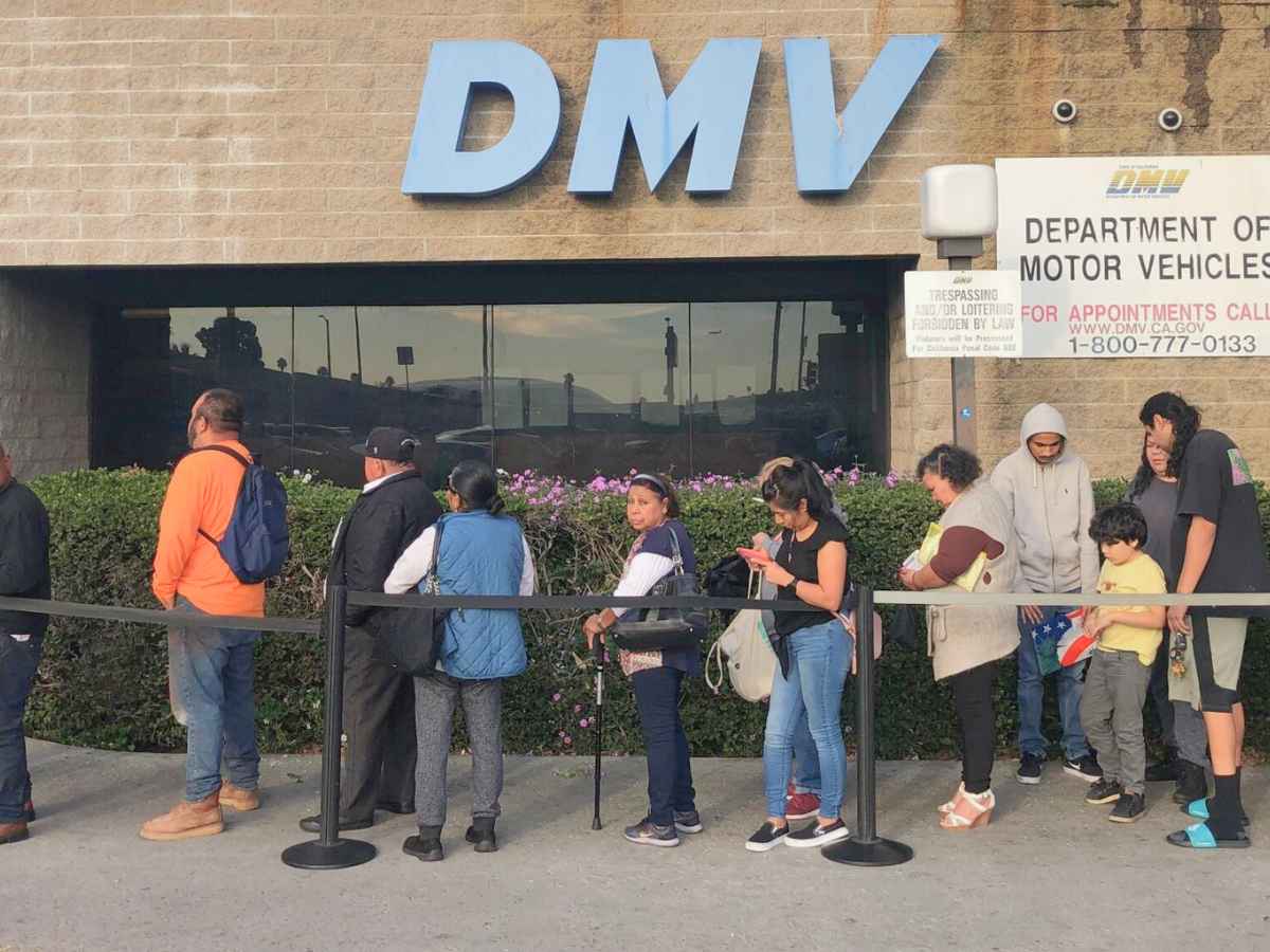 Residents line up outside a California DMV to apply for Real ID during the agency’s new early-morning processing hours