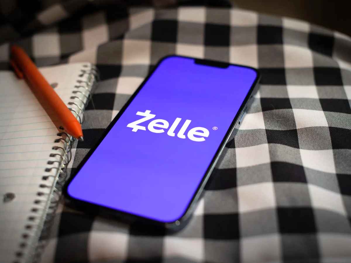 Smartphone displaying the white Zelle logo on a purple screen, illustrating the shutdown of Zelle’s standalone payment app