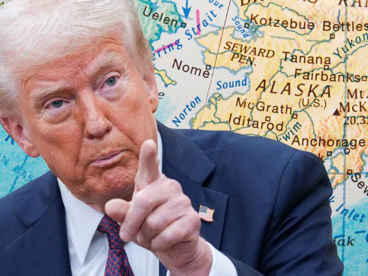 Close-up of a suited man pointing forward against an Alaska state map, illustrating news on the May 2025 $1,702 stimulus payment