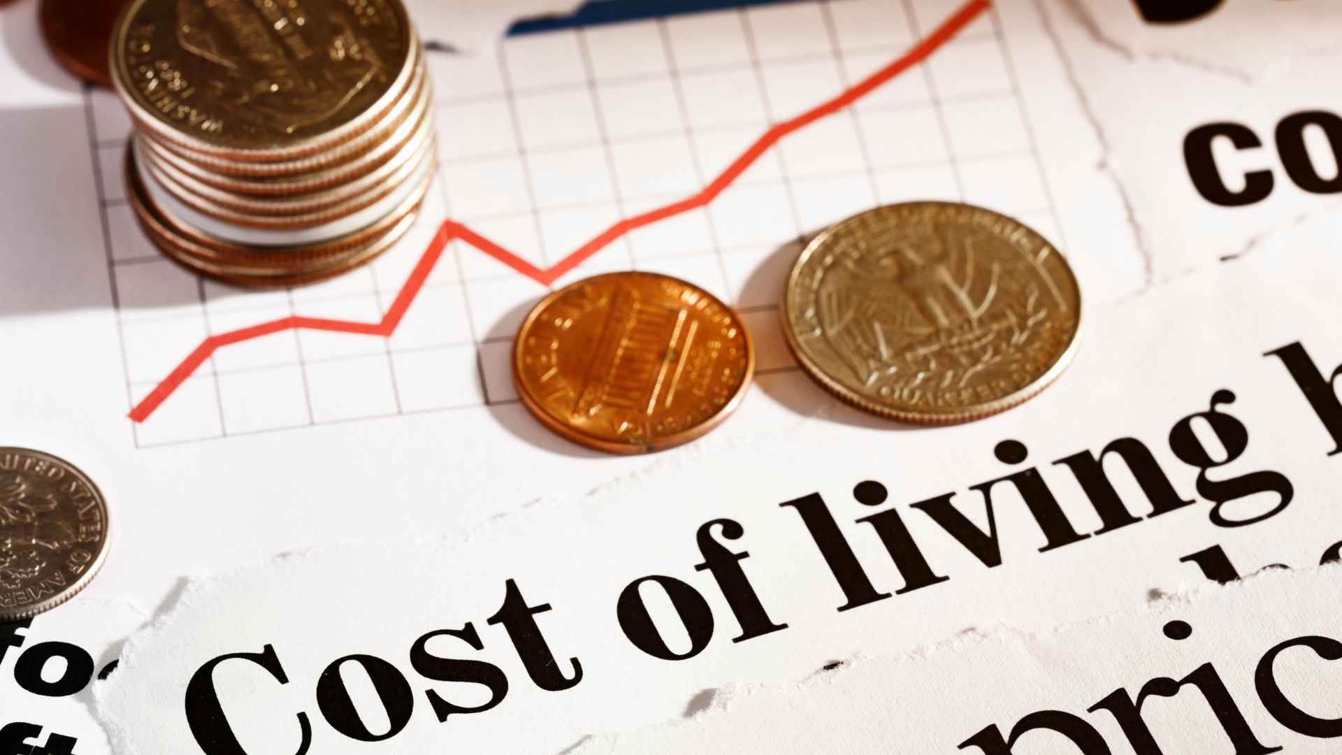 Line graph overlaid with U.S. coins illustrating the projected 2.4% increase in the 2026 Social Security COLA.
