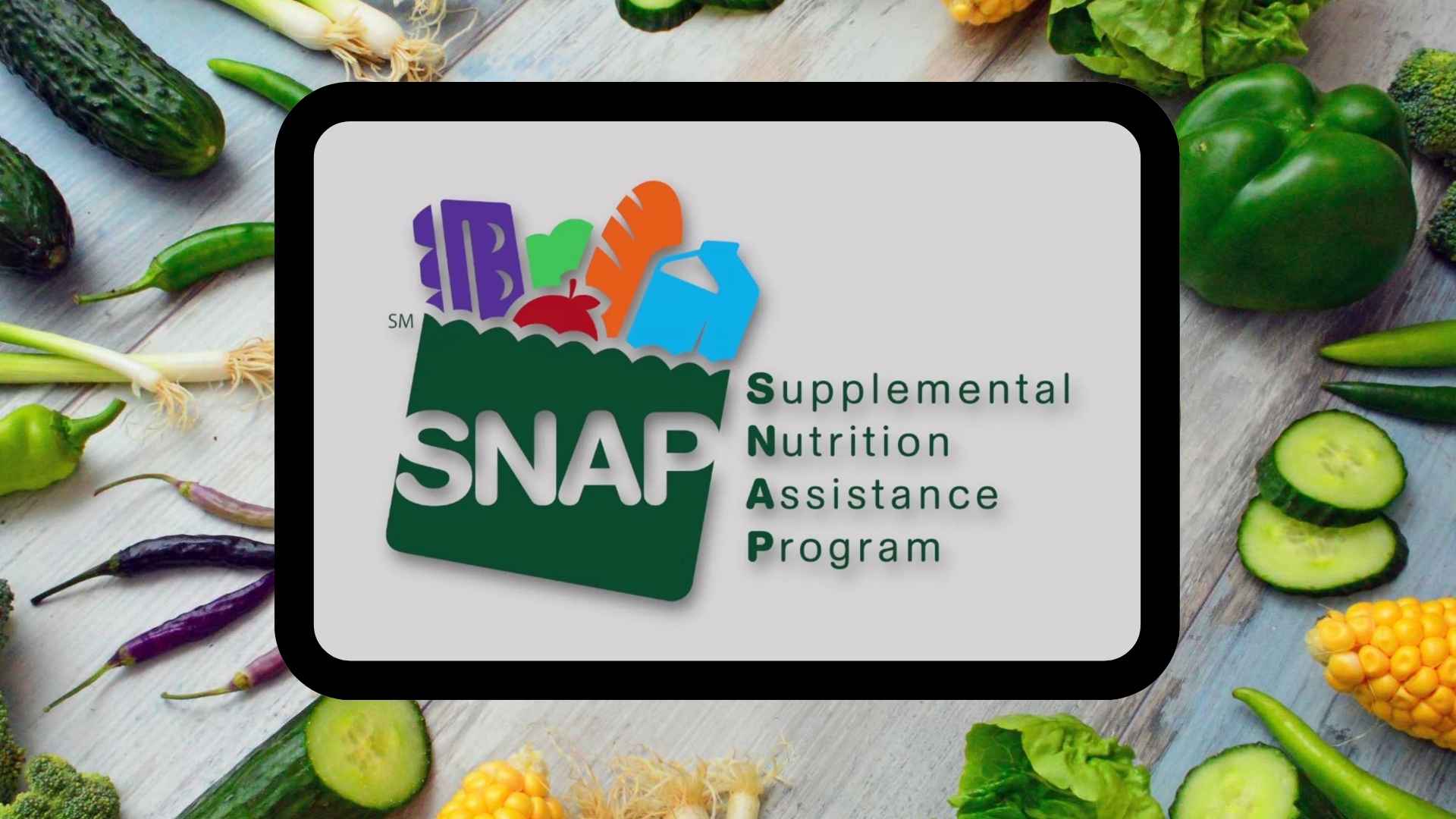 SNAP logo on tablet surrounded by fresh vegetables, representing recipients exempt from new 80-hour work requirements