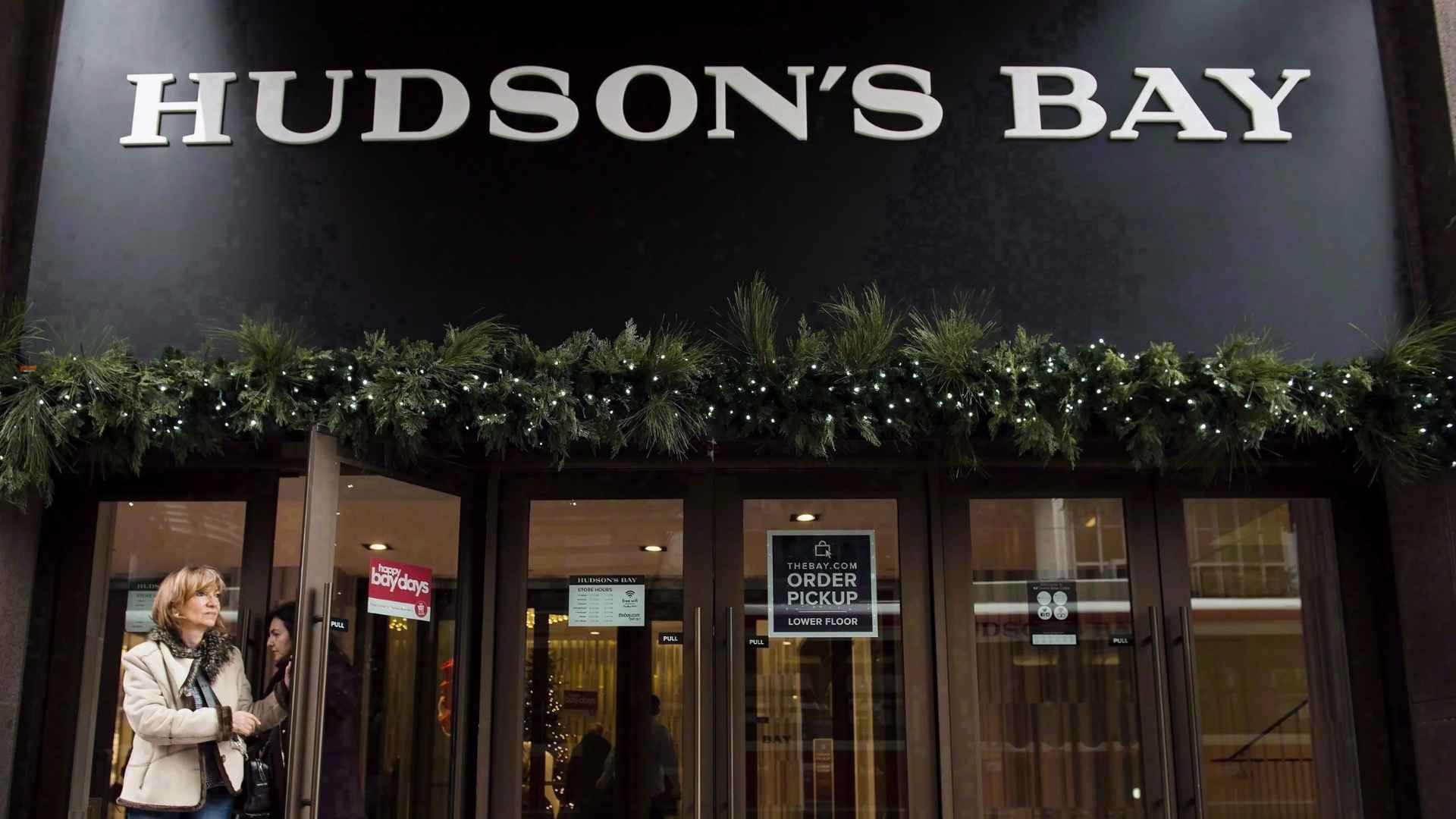 Hudson’s Bay storefront draped in holiday greenery as the 355-year-old Canadian retailer launches full liquidation and prepares to close its final six stores