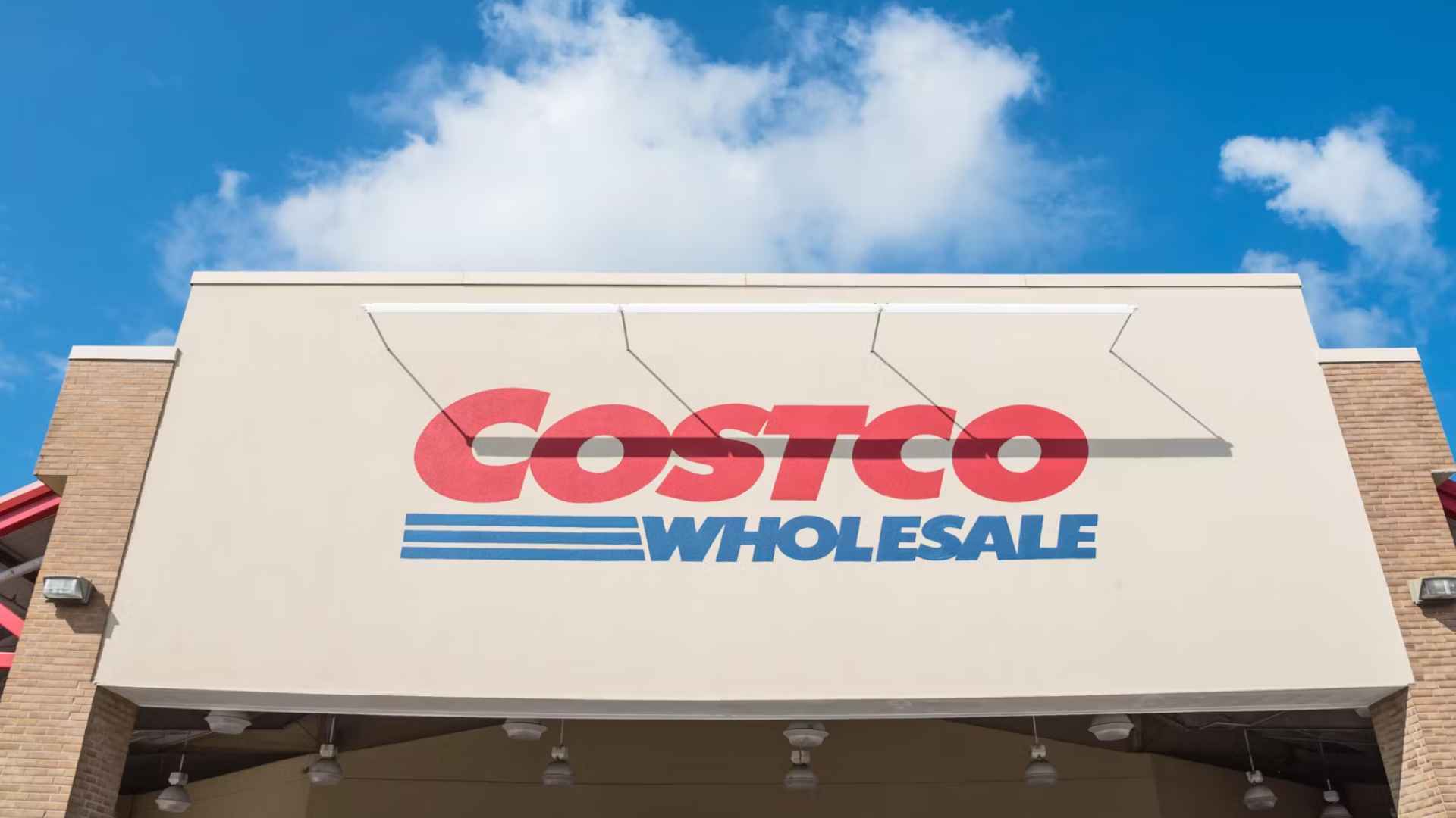 Costco Wholesale storefront with visible ‘Members Only’ sign at the entrance, illustrating the retailer’s tightened pay-to-enter membership policy