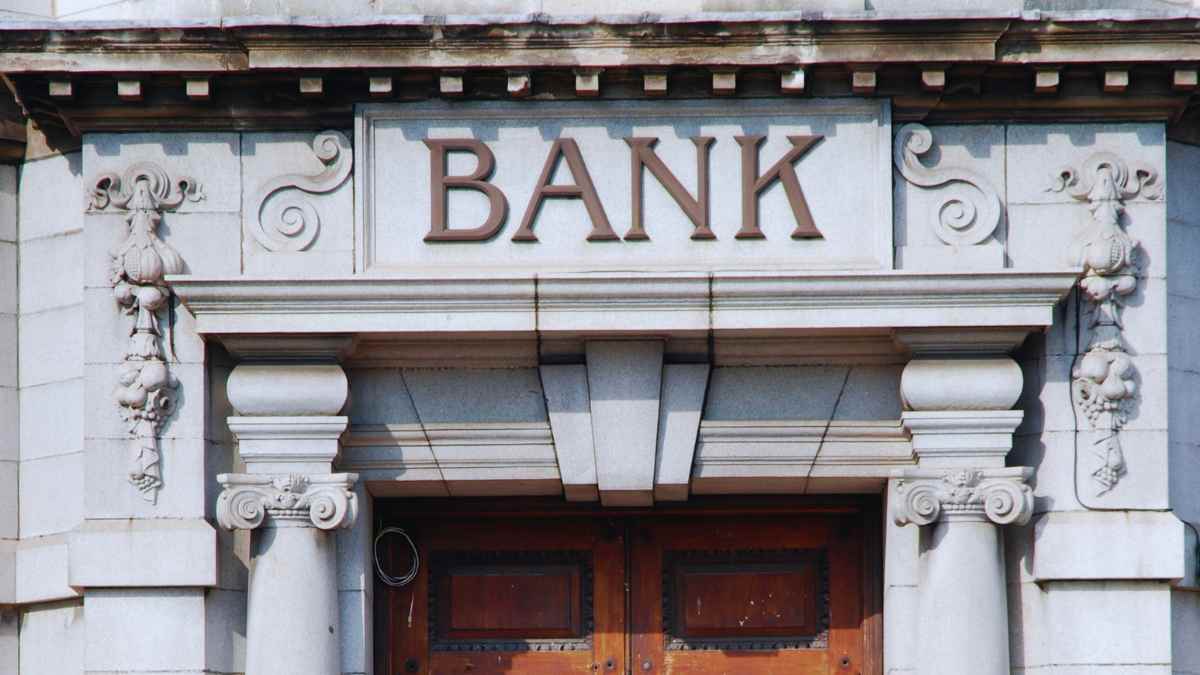 Historic bank building facade with closed wooden doors in the United States
