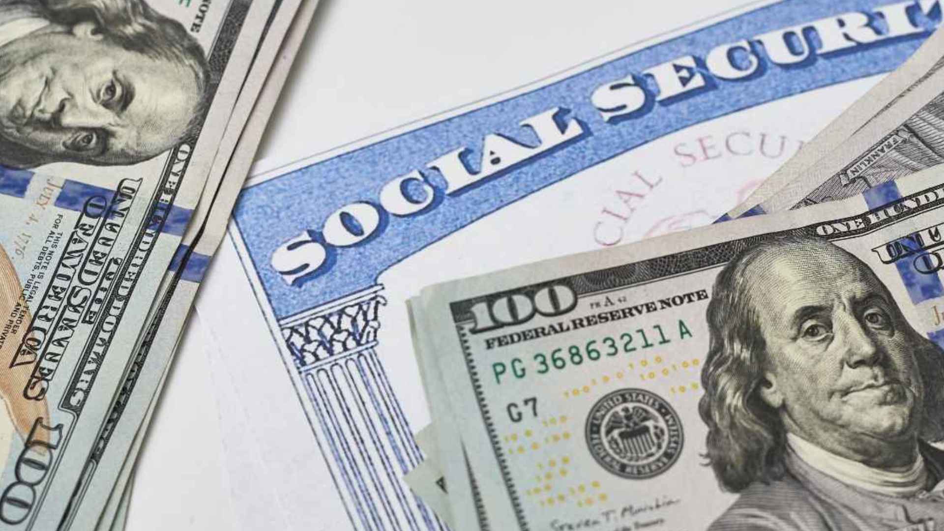 Social Security card under $100 bills, spotlighting paused automatic payments when beneficiaries fail to report changes