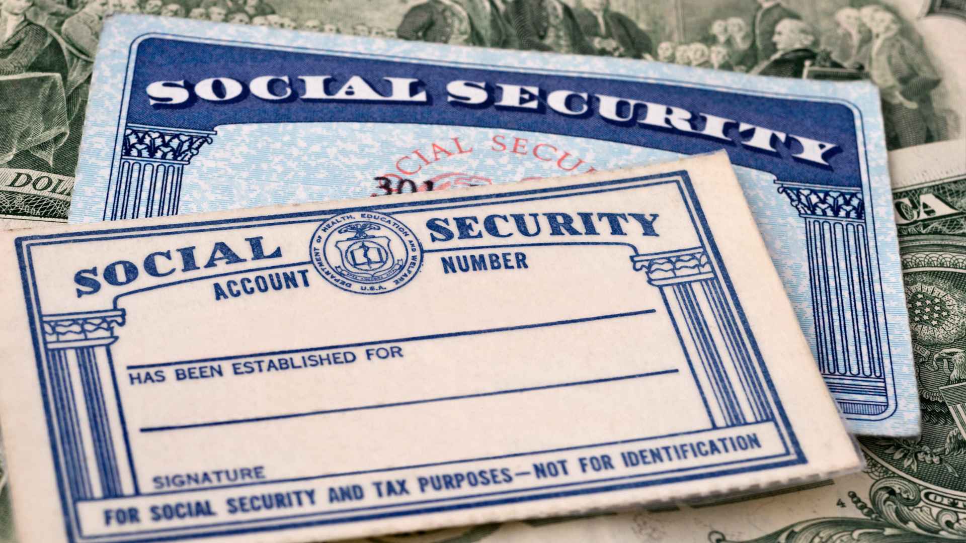 Close-up of a Social Security card and a $100 bill representing May 2025 benefit changes, faster deposits, and fraud prevention.