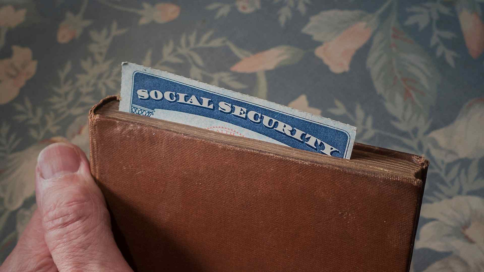 Social Security card in worn wallet symbolizing SSA’s extra SSI checks up to $967 this month
