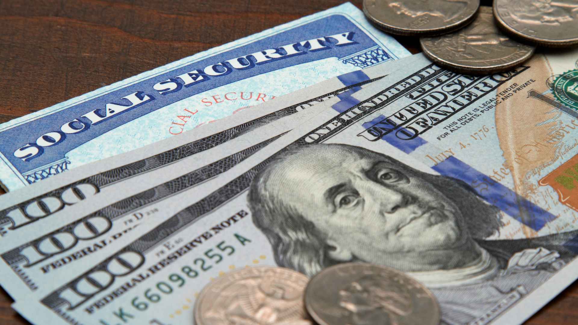 Social Security card with us dollar bills and coins illustrating ssa income limit on retirement pay
