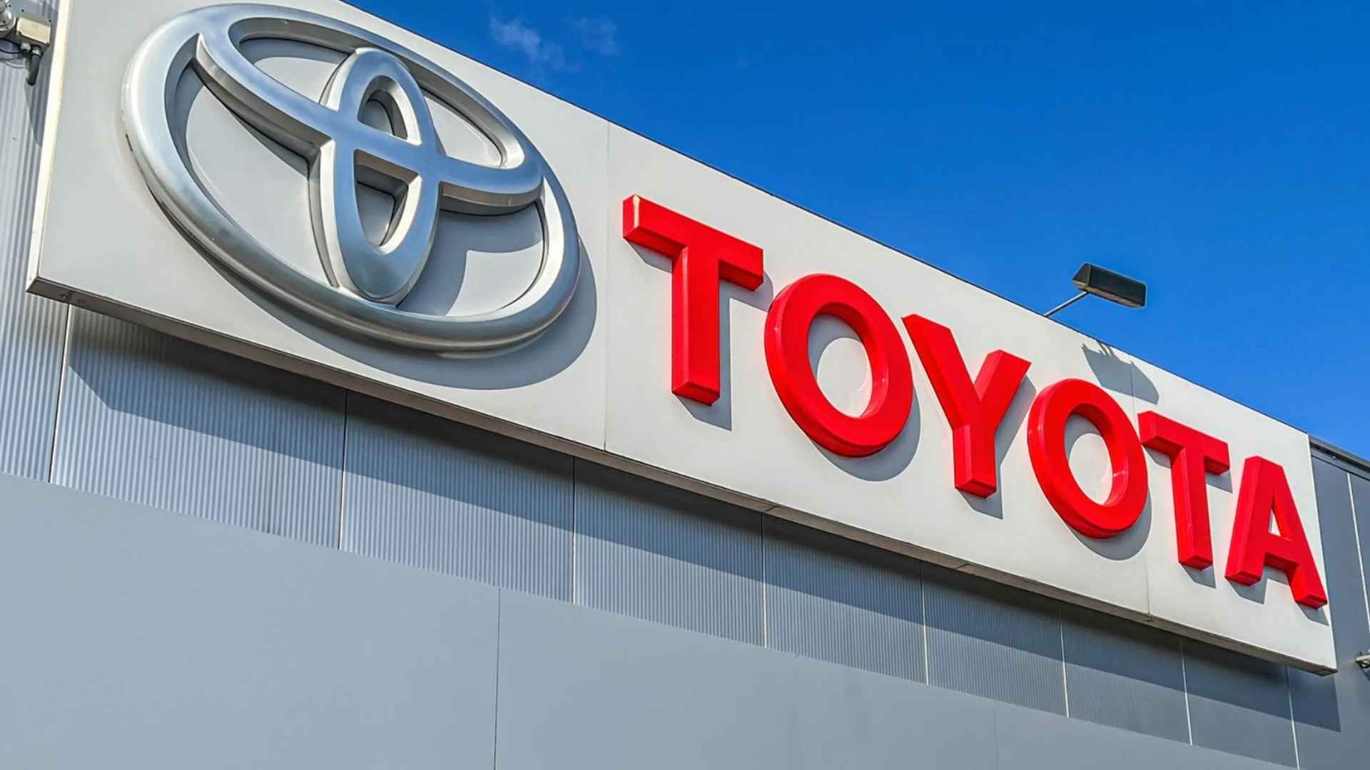 Toyota logo on dealership facade; brand recalls 147,000 U.S. vehicles for potential brake-hose leaks