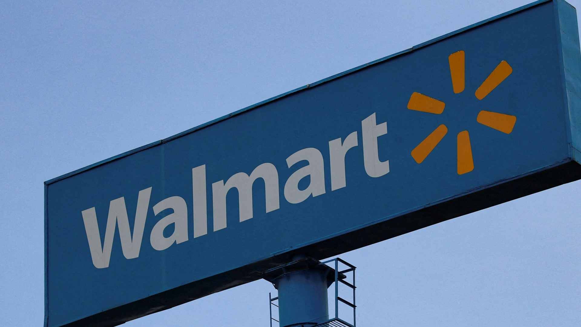 Blue Walmart store sign with spark logo during nationwide Bridgestone trailer-tire recall over blowout concerns.