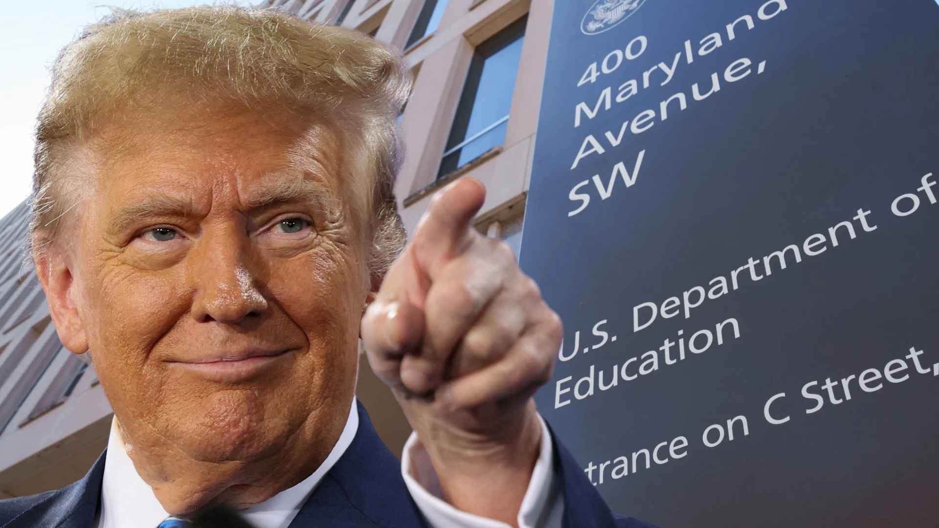 Man in a suit pointing beside a U.S. Department of Education sign at 400 Maryland Avenue SW in Washington, D.C.
