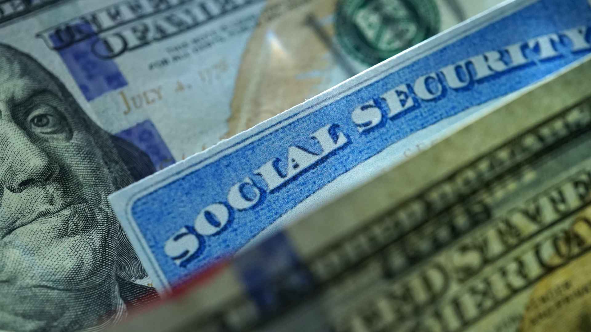 Social Security card atop hundred-dollar bills illustrating benefit requirements for June 2025