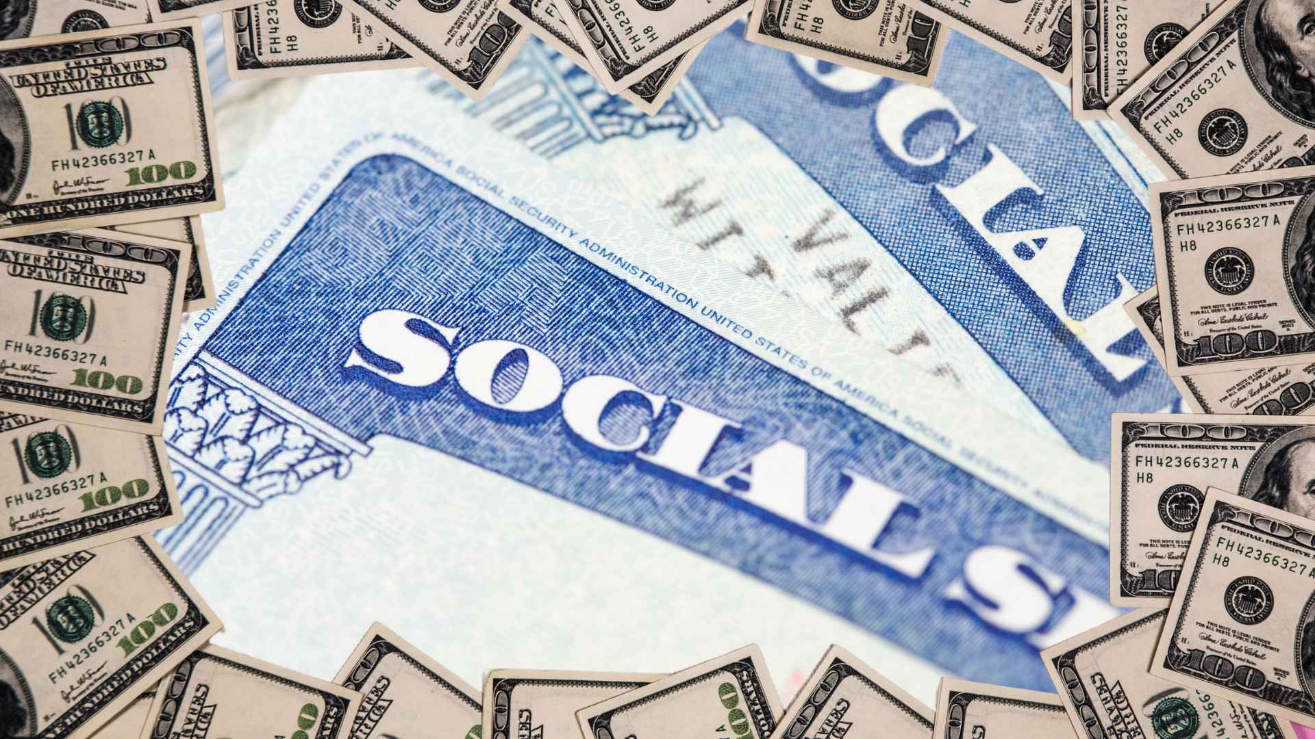 Social Security card encircled by hundred-dollar bills, symbolizing benefit-suspension risk in May 2025