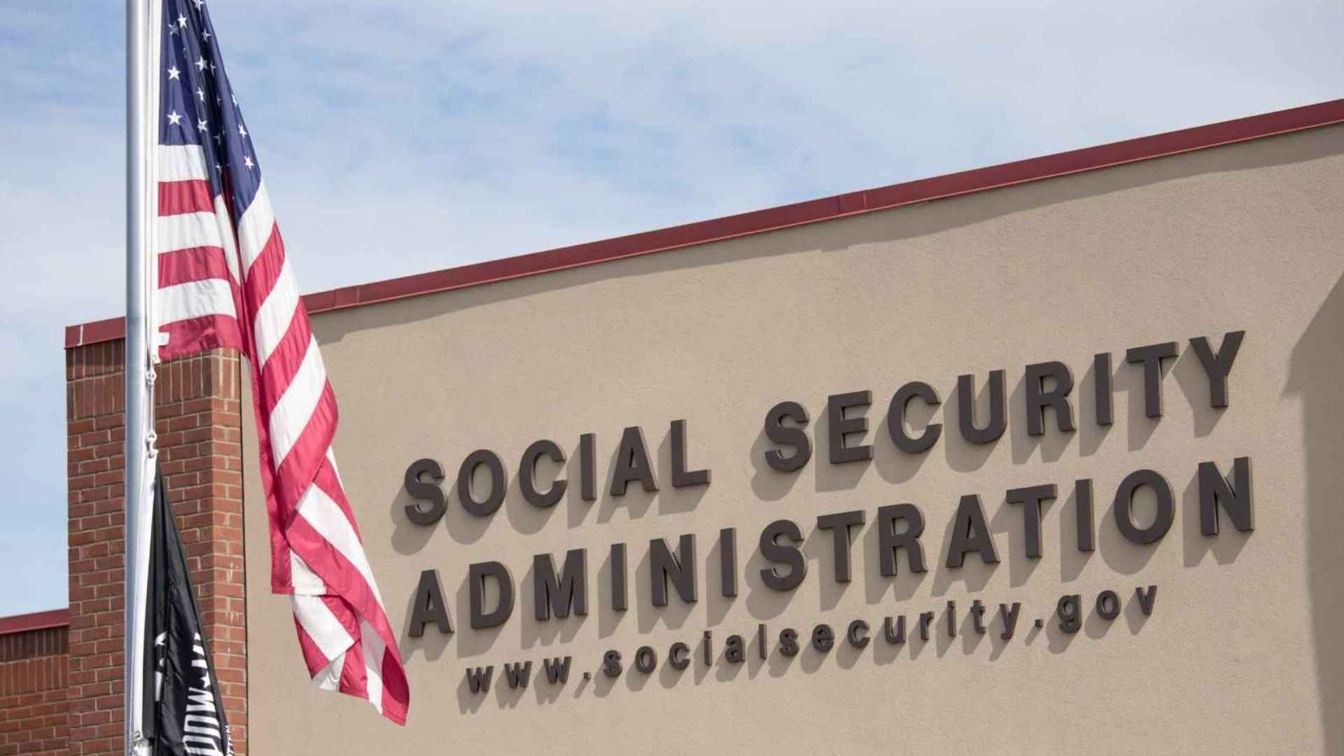 Social Security Administration building with U.S. flag, illustrating SSA shift from paper checks to direct-deposit benefits.