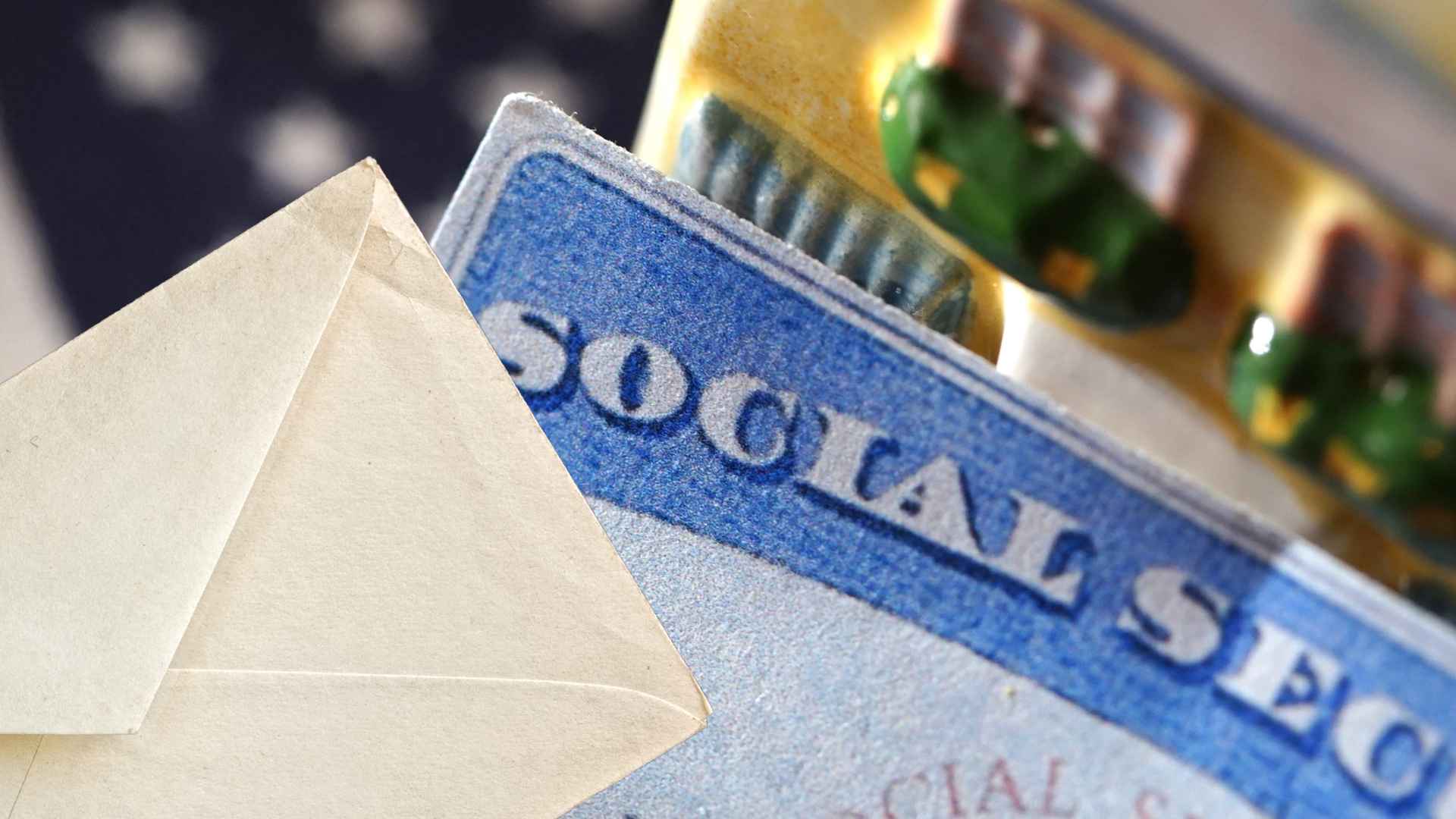 Close-up of a Social Security card tucked in an envelope, illustrating 2025 warning letters that could cut retirees’ checks in half