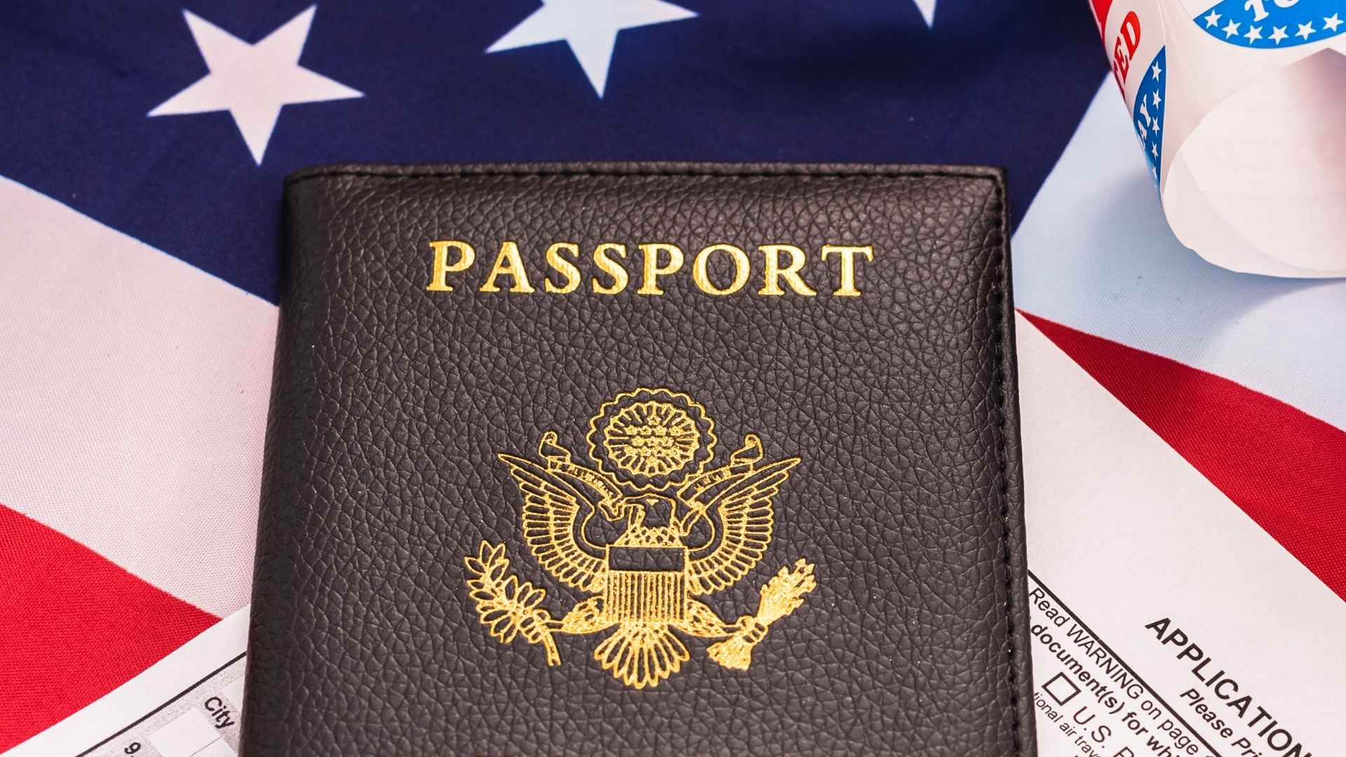 U.S. passport with American flag and citizenship application form