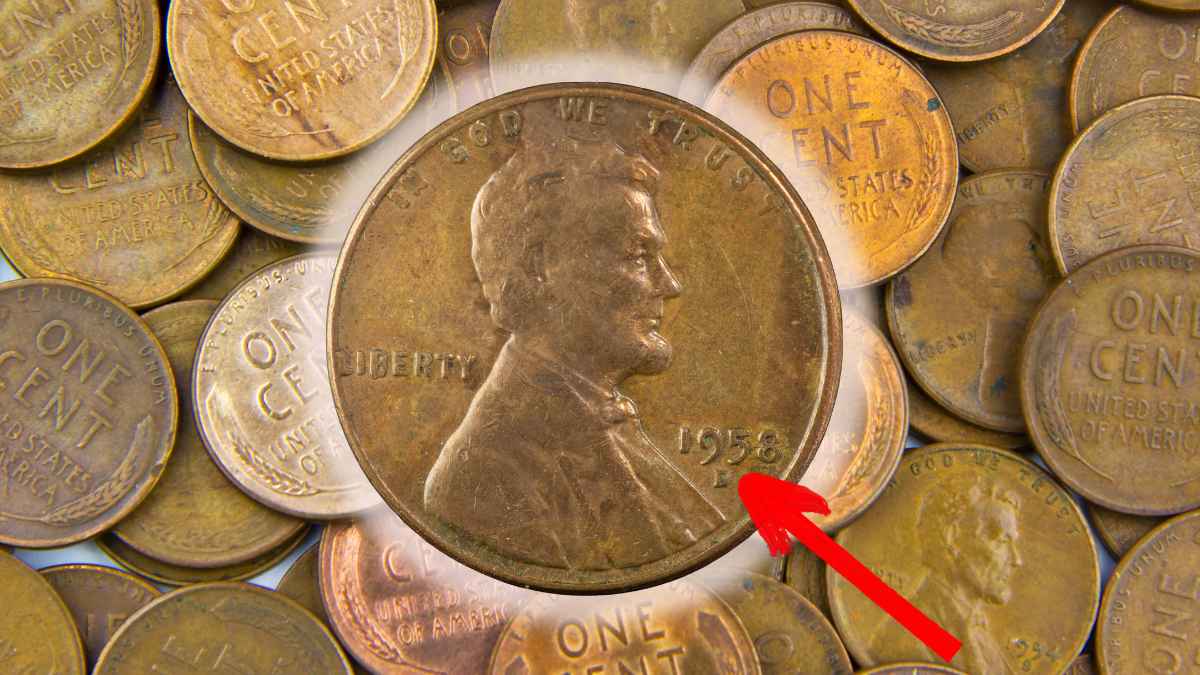 Close-up of a 1958-D Lincoln Wheat Penny highlighted with a red arrow among other wheat cents, illustrating the hidden-fortune coins that can be worth up to $49,000