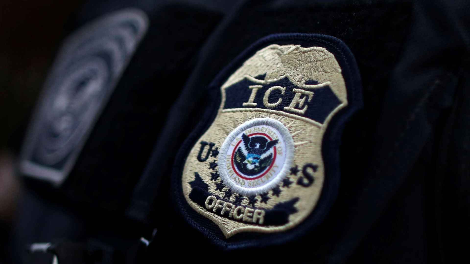 Badge of a U.S. Immigration and Customs Enforcement (ICE) officer representing new recruitment and salary increases by Homeland Security