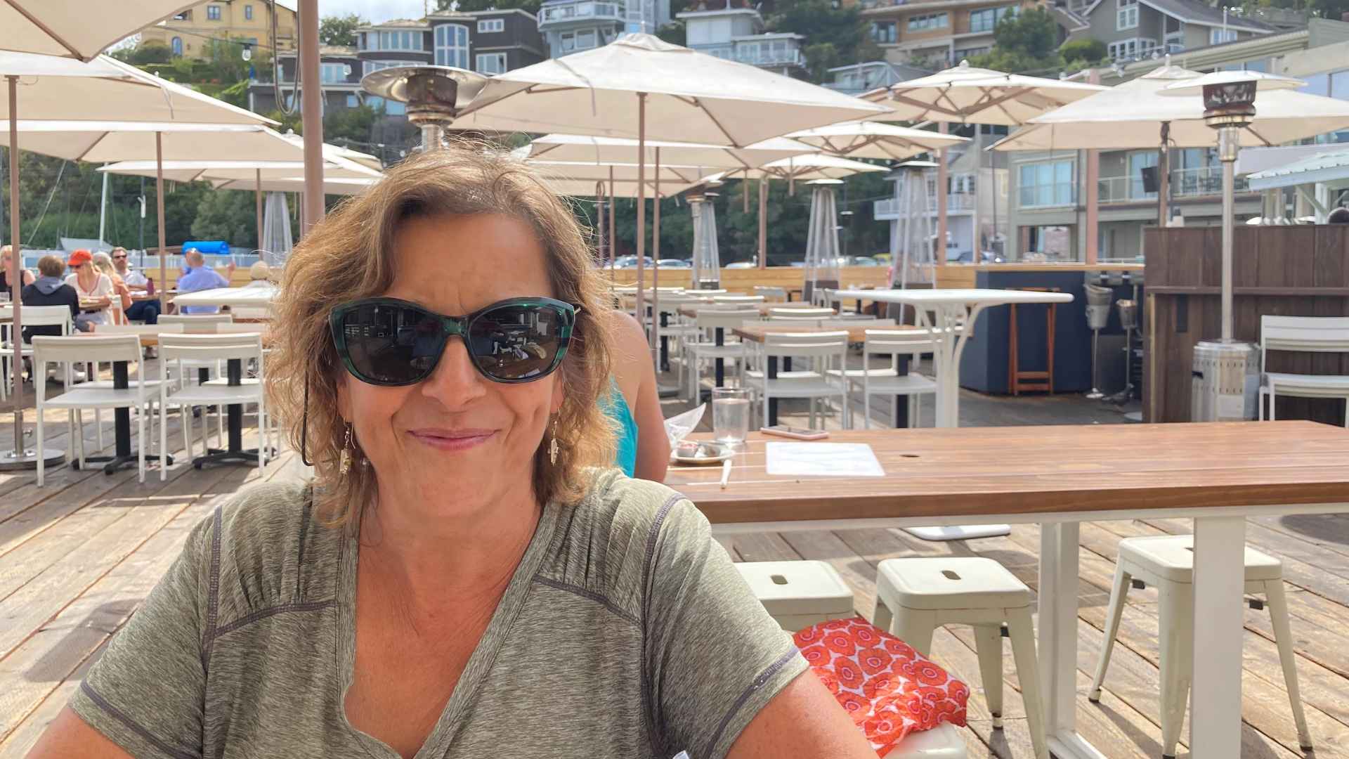 Smiling retired woman enjoying life abroad after leaving Colorado for a healthier lifestyle in Europe