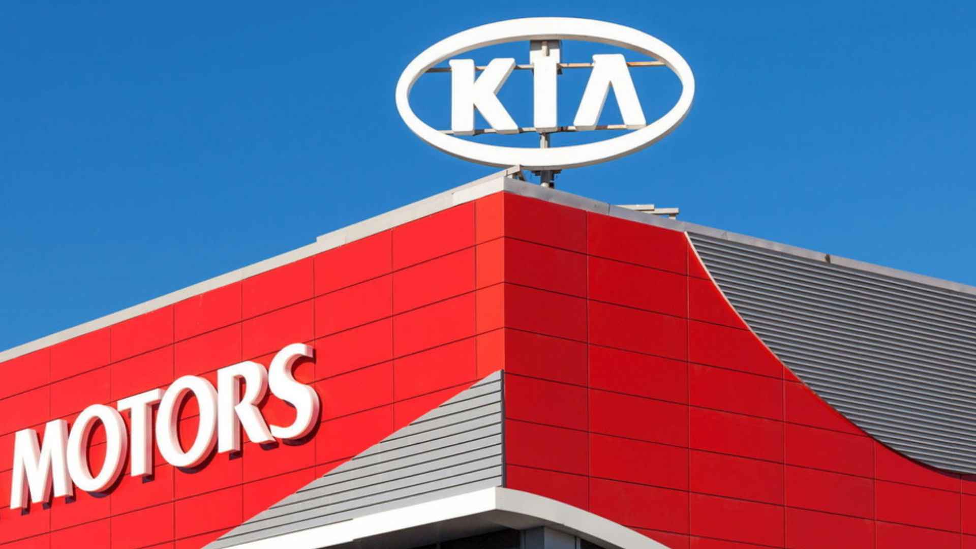 Kia Motors dealership sign, involved in recall of 300,000 vehicles for loose exterior parts