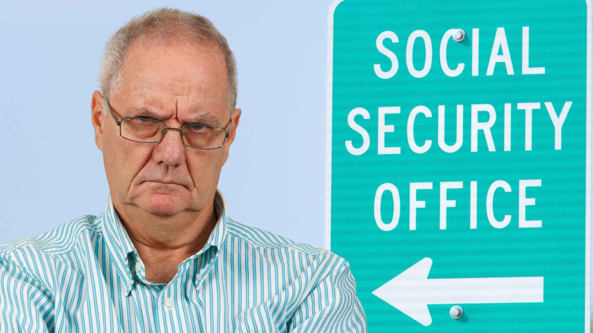 Frustrated elderly man standing beside a green Social Security office sign with a directional arrow.