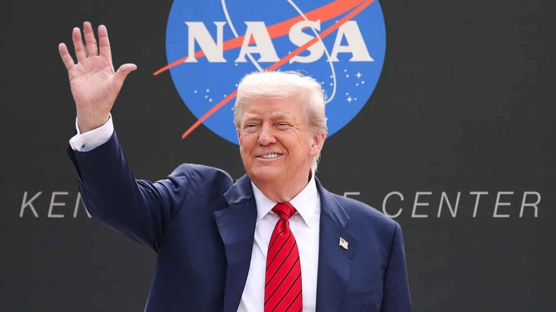 Donald Trump waving in front of the NASA emblem at Kennedy Space Center.