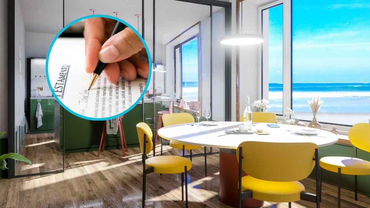 Persona firmando un testamento a mano junto a un comedor moderno con vistas al mar, representando la herencia de una vivienda no registrada avalada por la Justicia