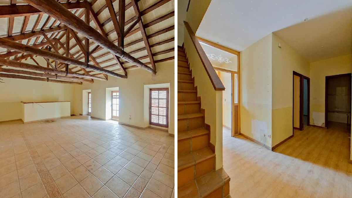 Interior del piso de 100 m2 con vigas de madera en venta por Banco Santander en Arenas de San Juan