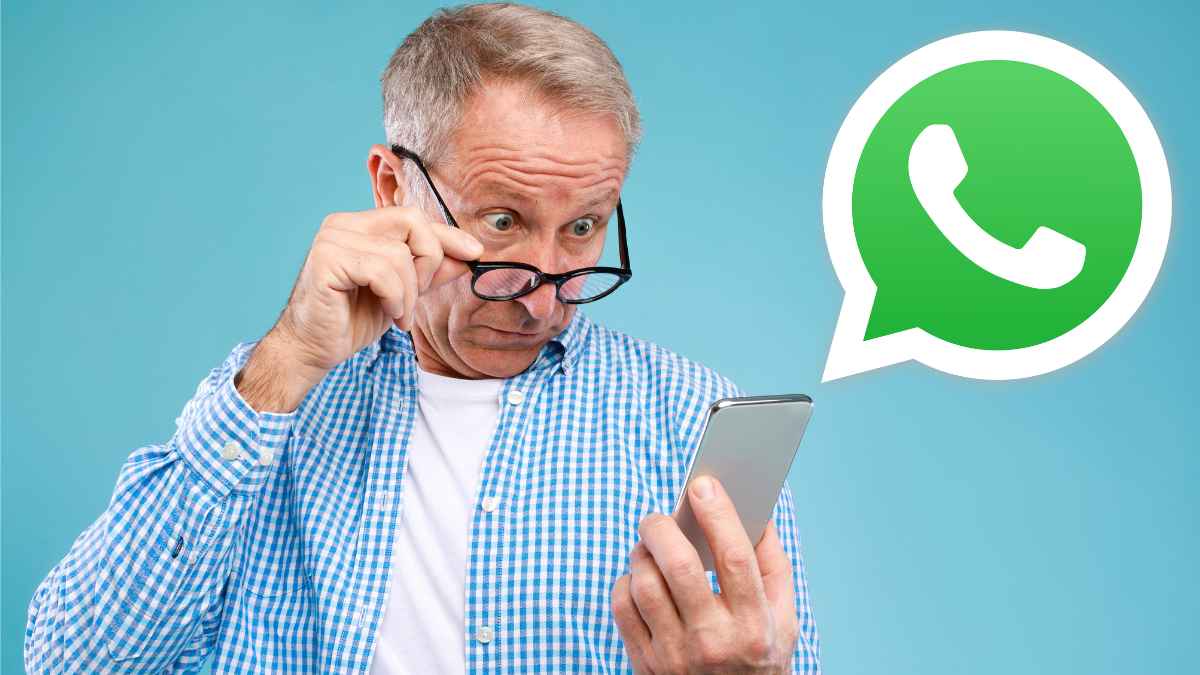 Hombre sorprendido mirando su móvil relacionado con un caso de despido por foto en WhatsApp